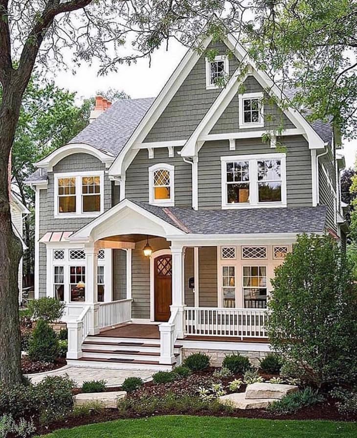 Grey farmhouse exterior with front porch