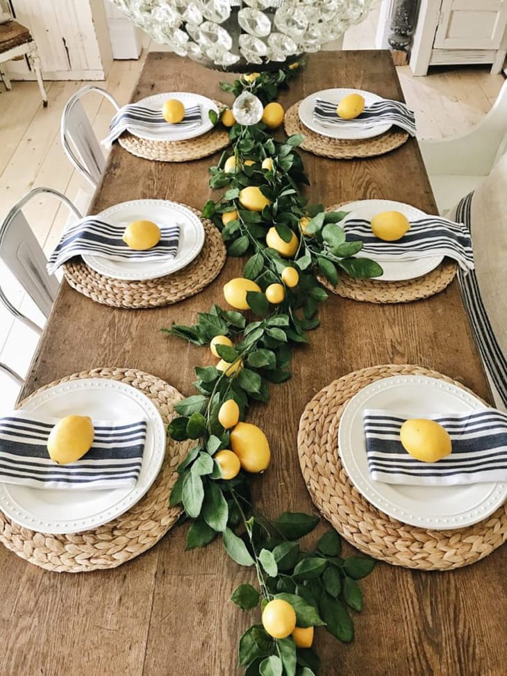 Dining table decorated with lemons, spring tablescape with lemons