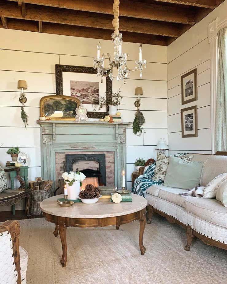 round marble top coffee table in a rustic living room