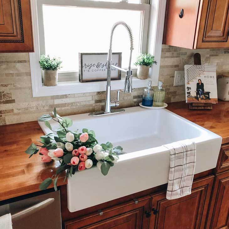 farmhouse sink on wood kitchen