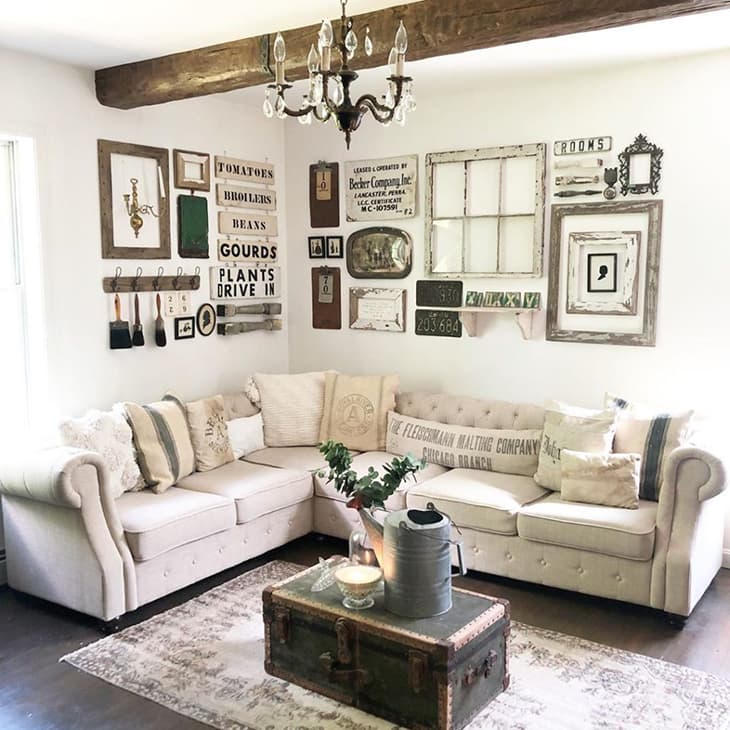 farmhouse living room gallery wall with window pane over sectional sofa