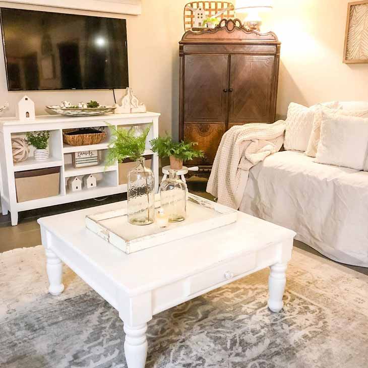 white square coffee table with centerpiece