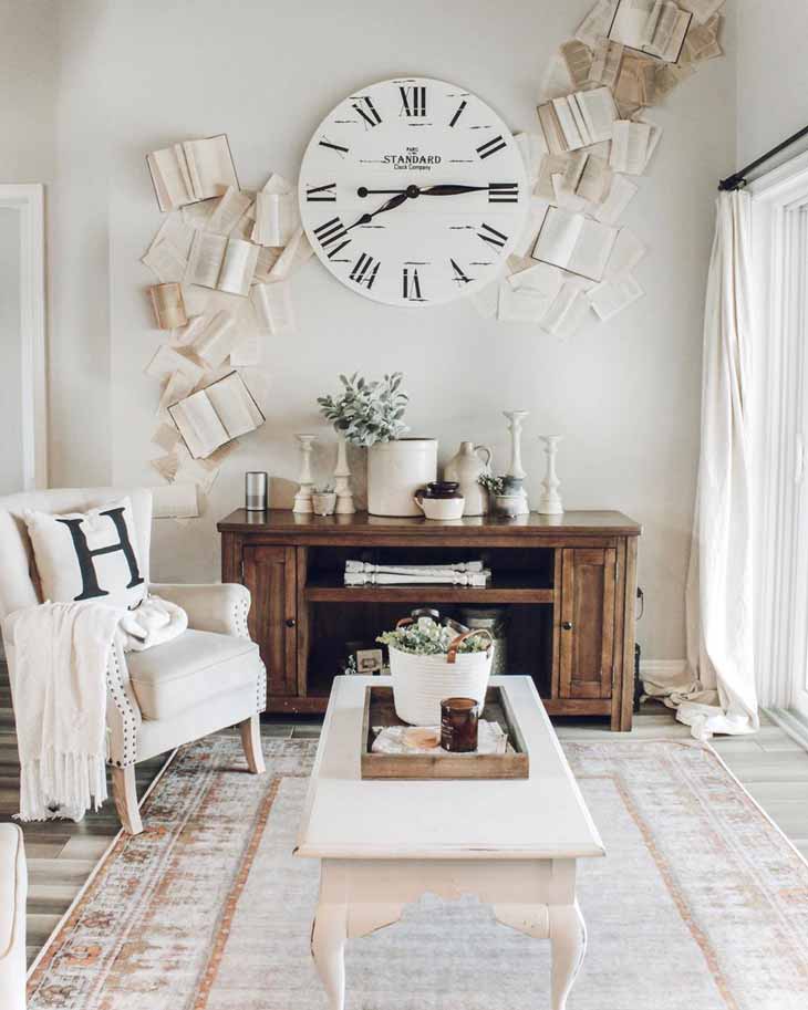 rectangular coffee table in front of a wall decorated with big farmhouse clock