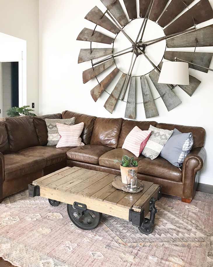 cart farmhouse coffee table in front of a brown leather sectional