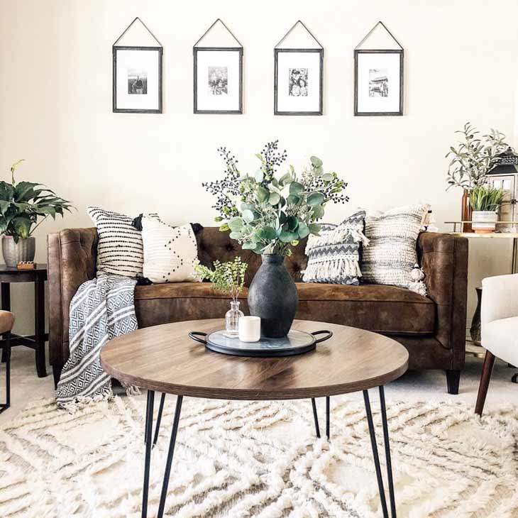 round coffee table centerpiece with serving tray and black vase