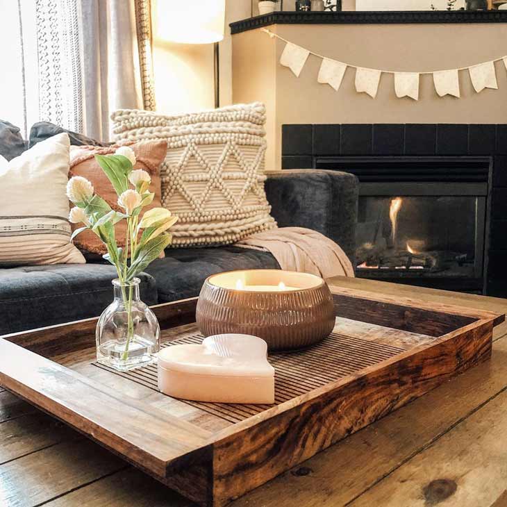 coffee table decor with wooden tray, candle and small vase