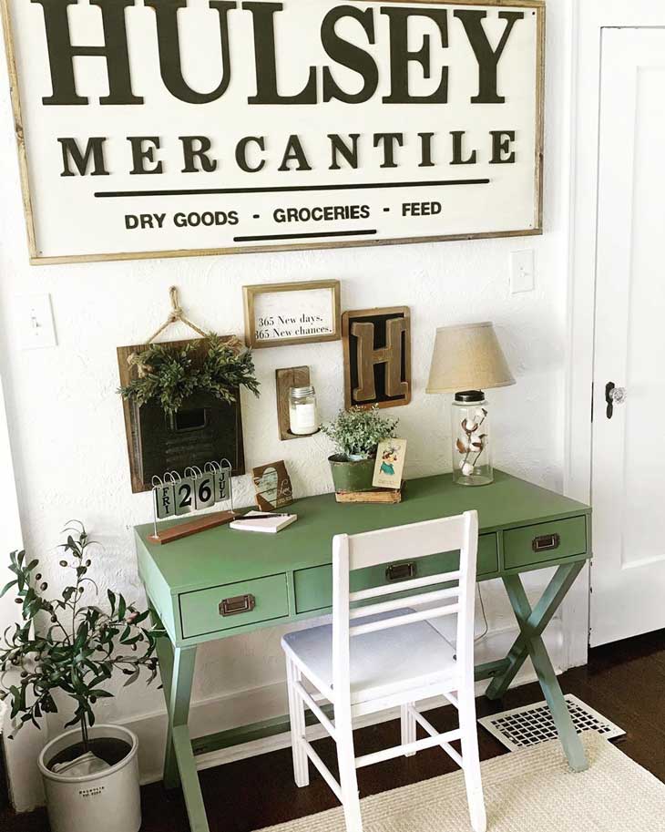 home office with green farmhouse desk and big farmhouse sign