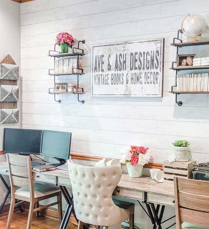 home office with farmhouse sign and shiplap walls