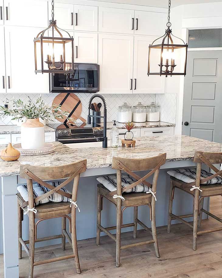 kitchen rustic lantern pendant lights over kitchen island with wood bar-stools