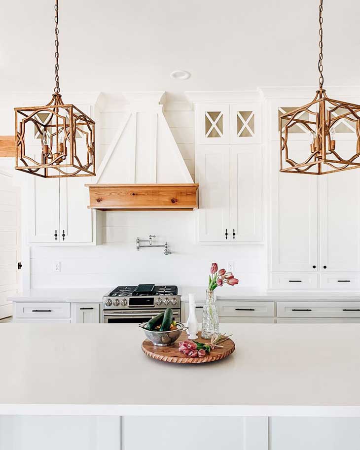 gold metal pendant lighting in white modern farmhouse kitchen