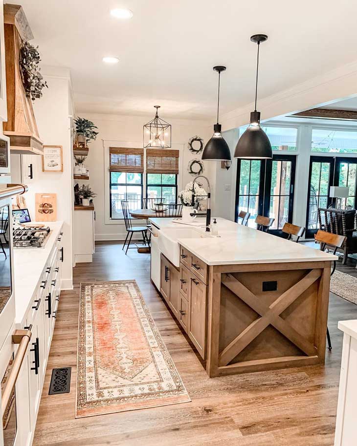 black pendant lighting over wood kitchen island