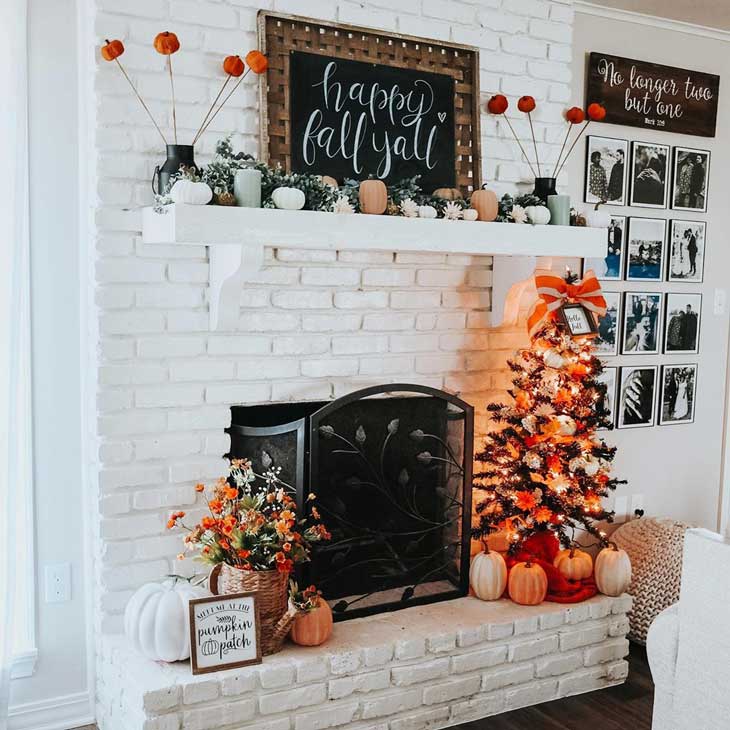 White brick fireplace with fall decor