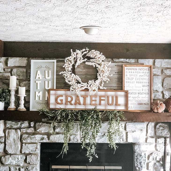 White stone fireplace with neutral decor