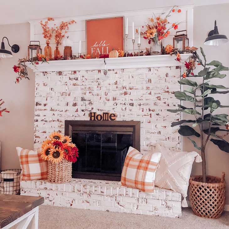 Whitewashed fireplace with fall decor