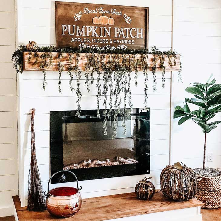 White shiplap fireplace with fall decor