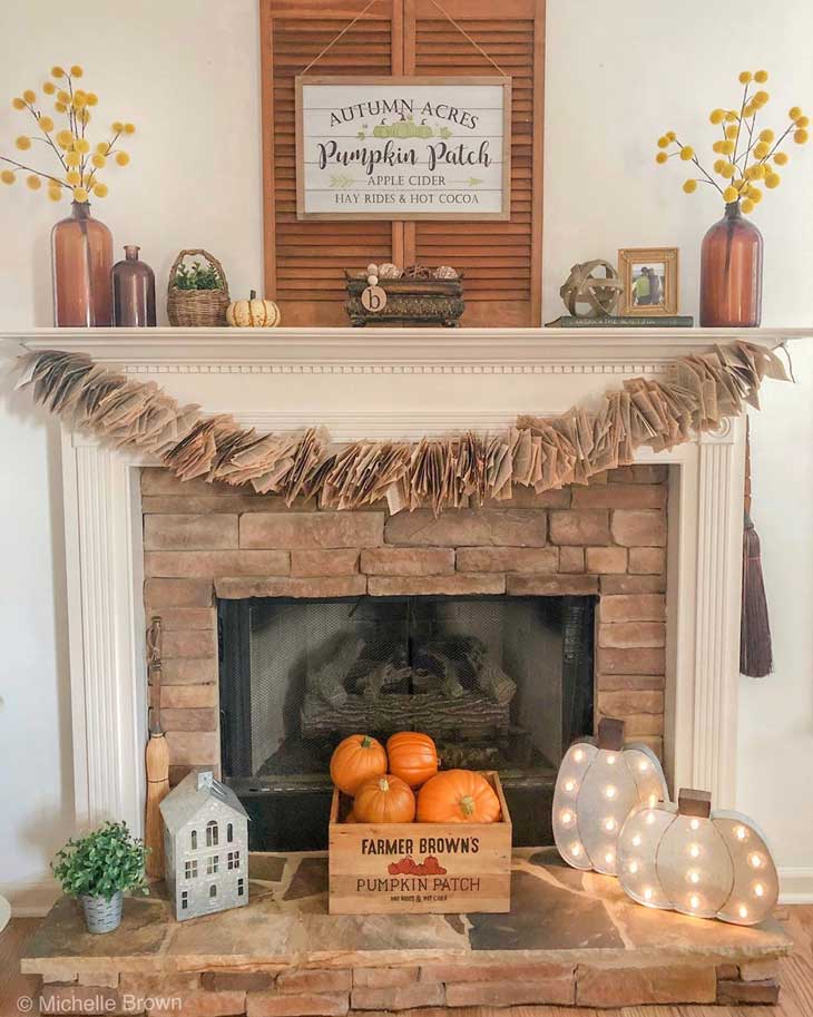 fall mantel decor on whtie fireplace