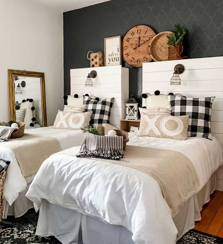 Black and white kids room with shiplap headboard and twin beds on a black accent wall