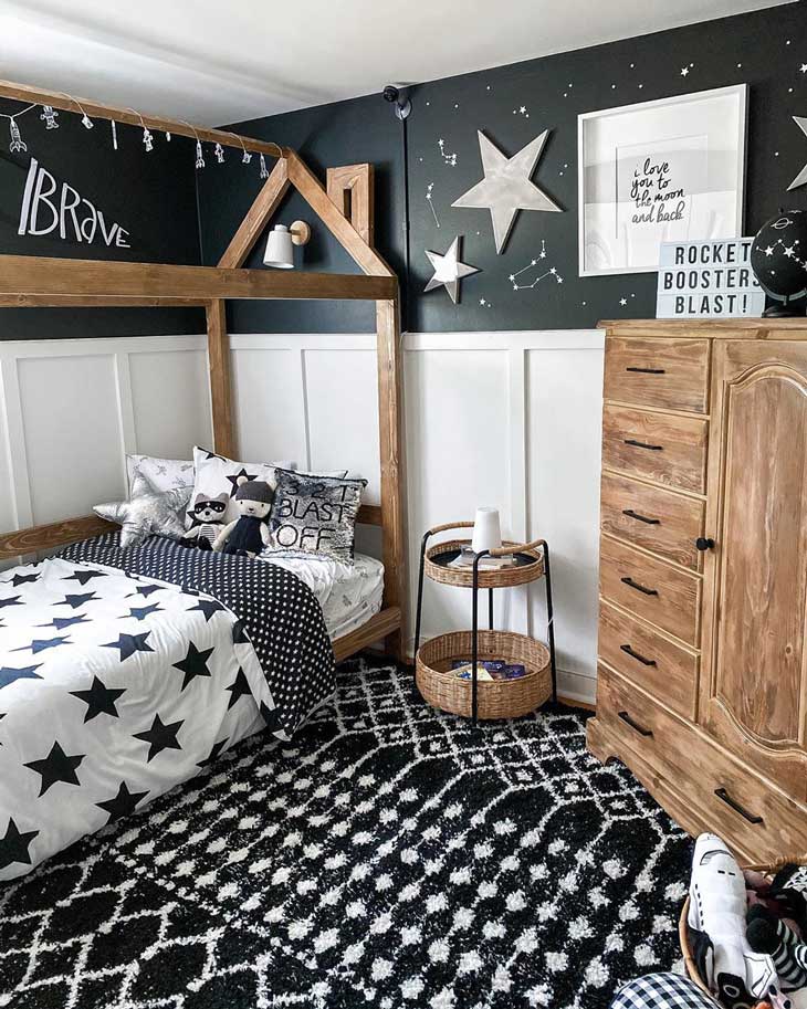 black and white kids room with wooden bed and stars decor