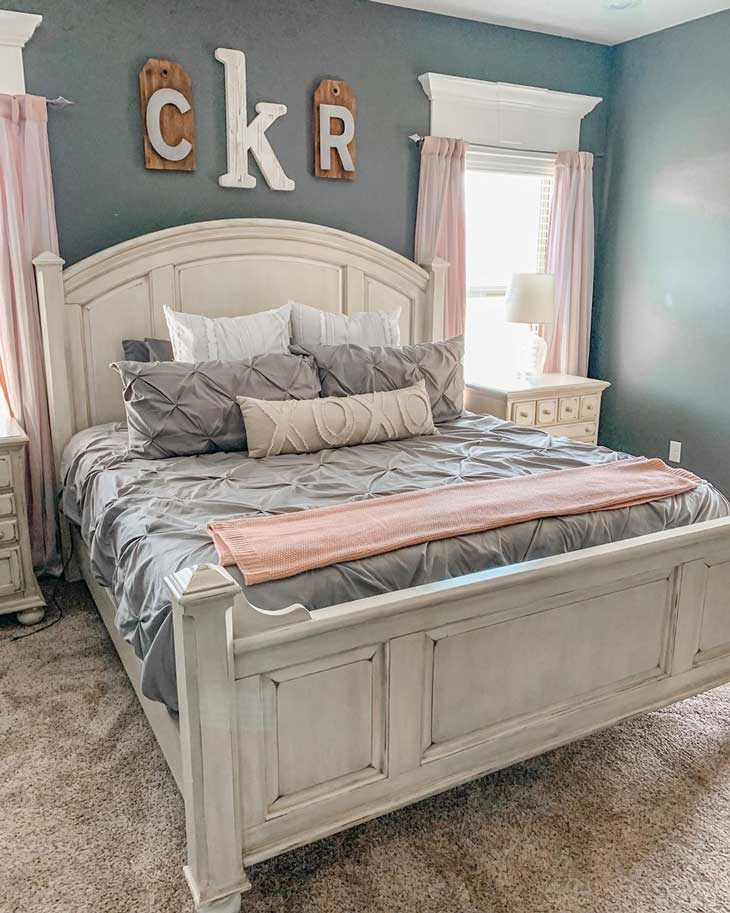 Girls kids room with pink and grey decor, white rustic bed