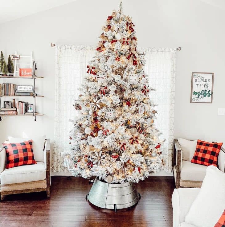 Red and white Christmas tree decor with red buffalo check ornaments and galvanised tree skirt