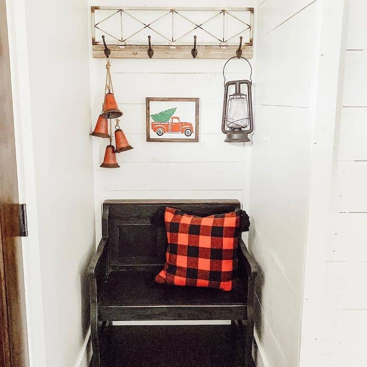 Christmas entryway bench with buffalo check pillow