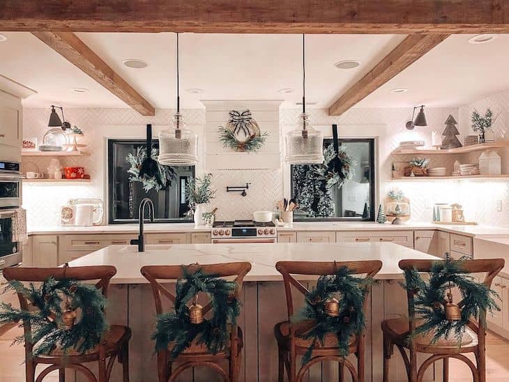 Kitchen Christmas decor with wreaths on high chairs