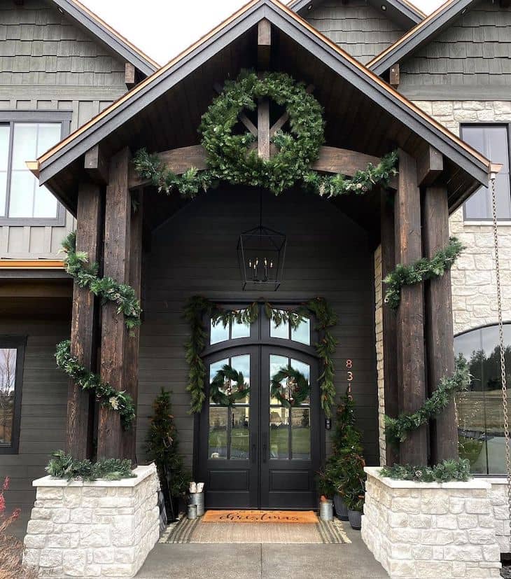 Christmas decor for double black front door with garland and wreaths