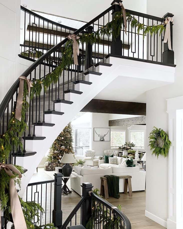 Christmas staircase decor with pre-lit green garland