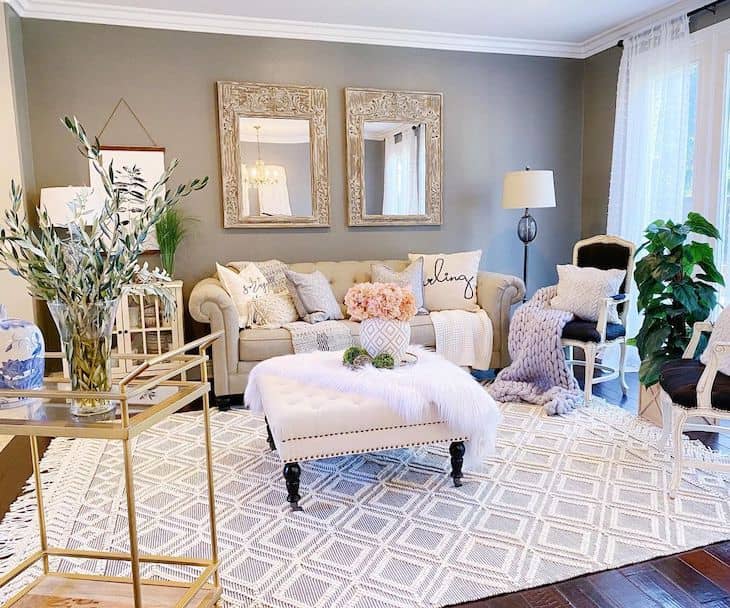 Farmhouse living room with tufted sofa and ottoman 