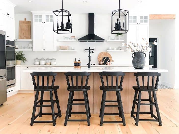 Modern farmhouse kitchen with open shelving around the black range hood