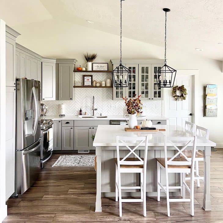 Grey farmhouse kitchen with open shelves above the kitchen sink