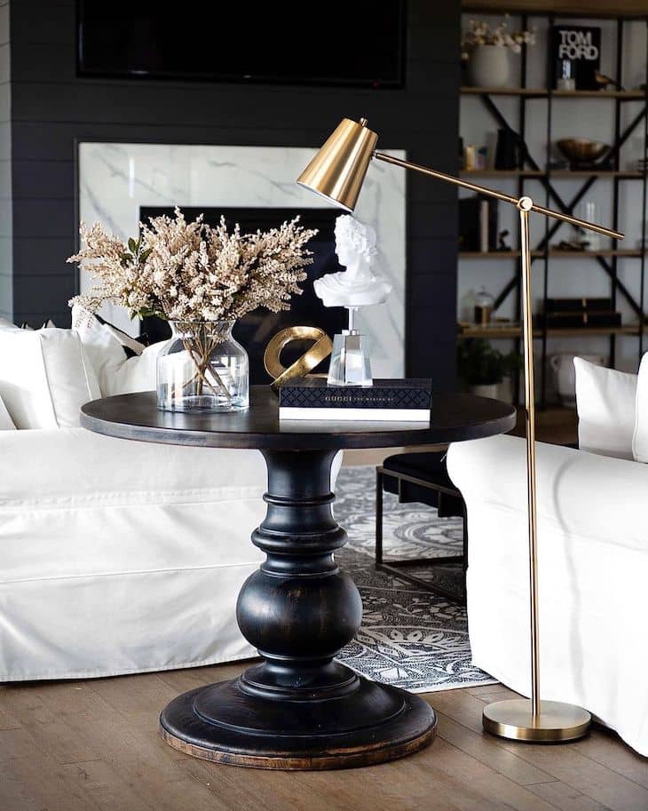 Black round end table with decor