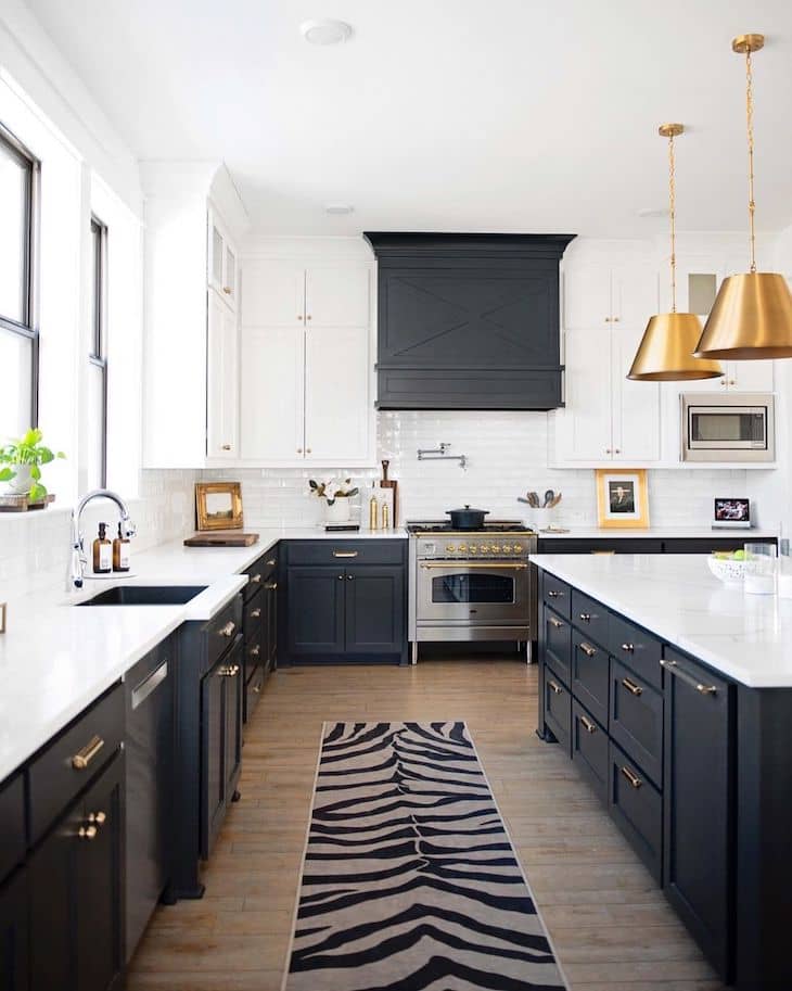 Modern farmhouse kitchen with white upper and black lower cabinets