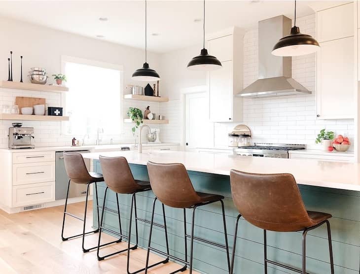 Open shelf kitchen with green shiplap island