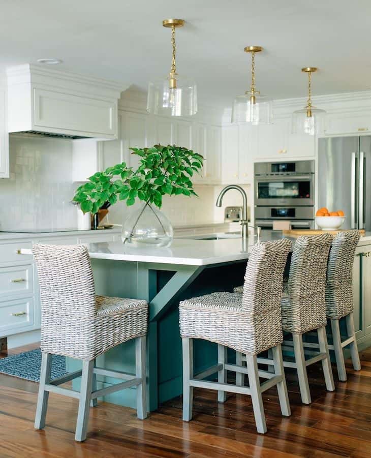 White kitchen with green kitchen island