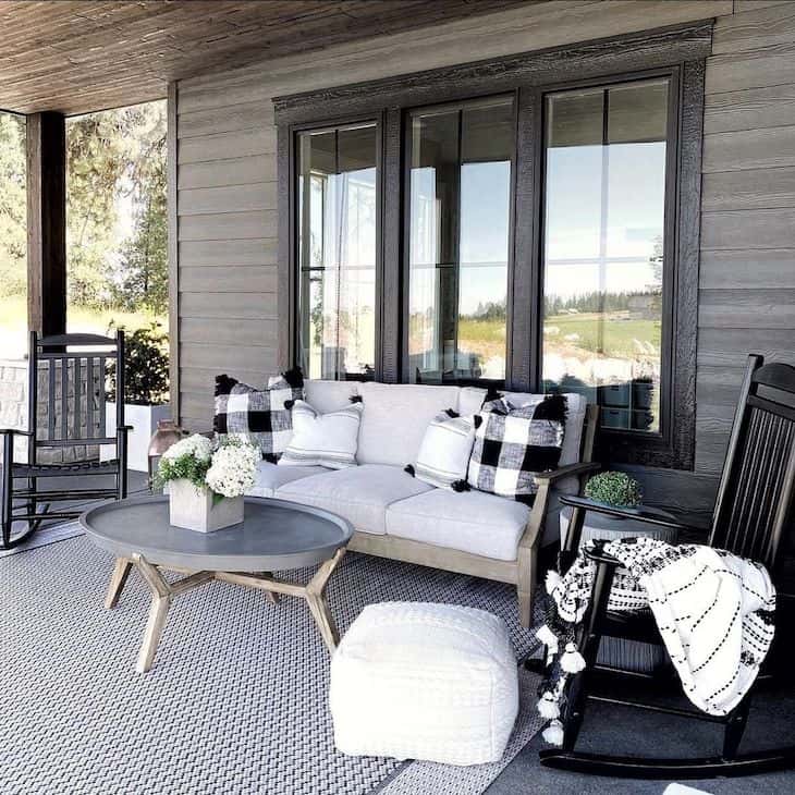 Patio decor with wood furniture and black rocking chairs