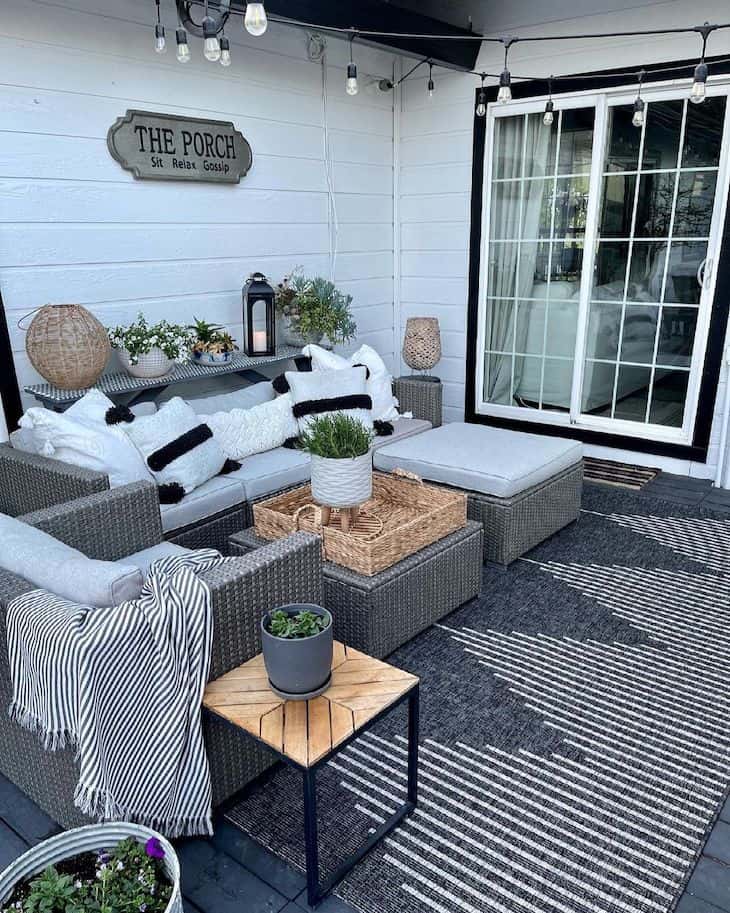 Farmhouse patio decor with grey outdoor rug