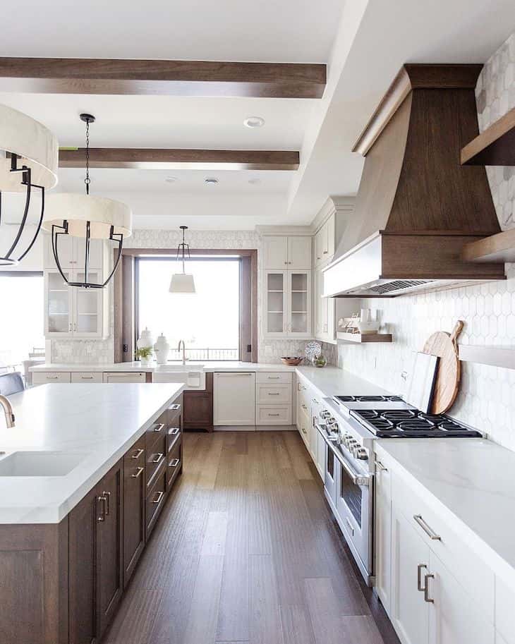 White farmhouse kitchen cabinets white deep wood tone kitchen island and wood range hood