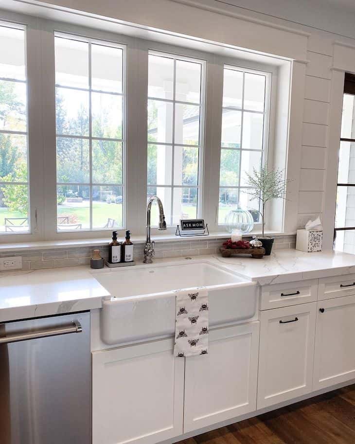 farmhouse sink in front of a window