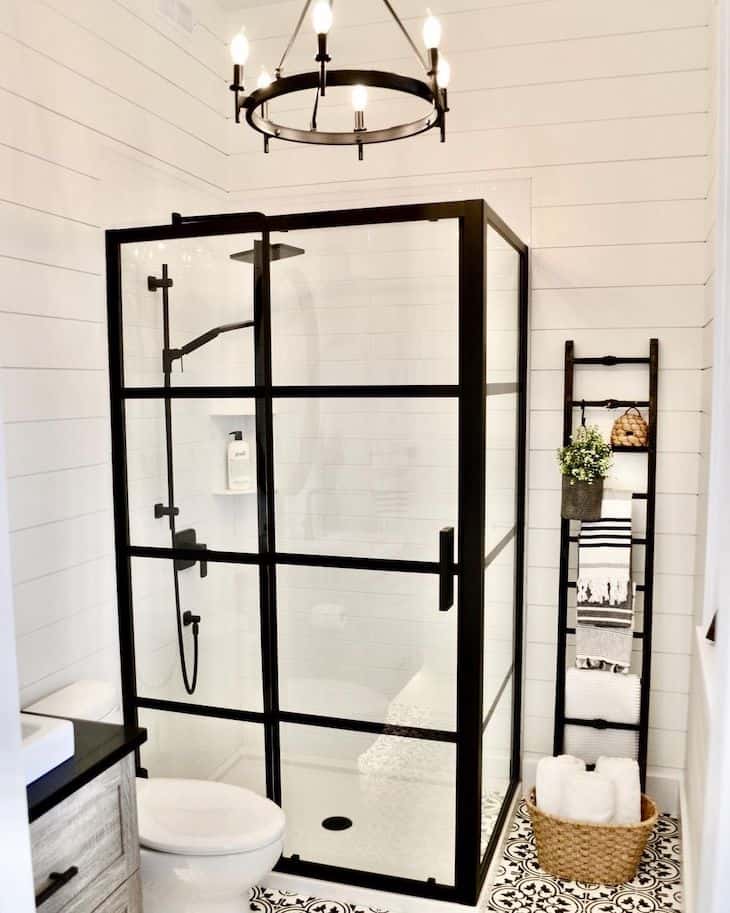 White subway tile for shower with shiplap walls and black shower glass frame