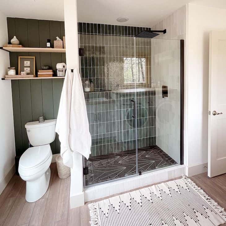 Forest green shower tile in farmhouse bathroom