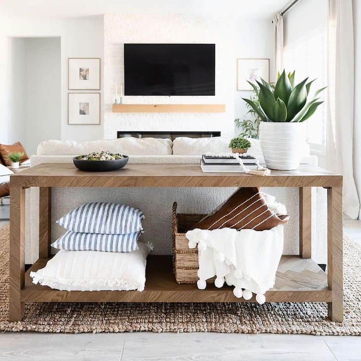 Long sofa table in natural wood with storage shelf below