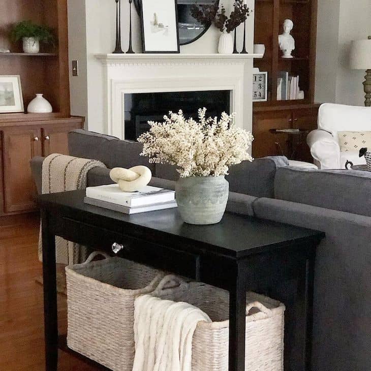 Black sofa table with neutral decor