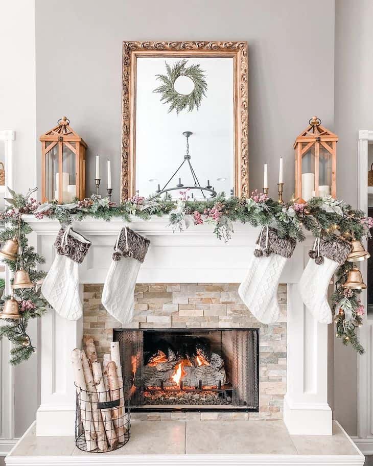 Classy Christmas mantel decor with white knitted socks and green garland