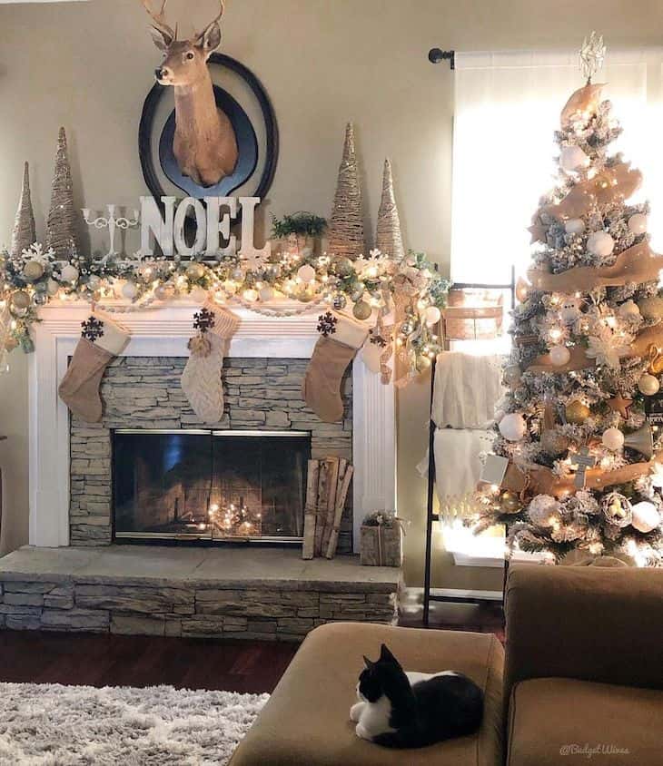 Fireplace with gold holiday decor and Christmas tree