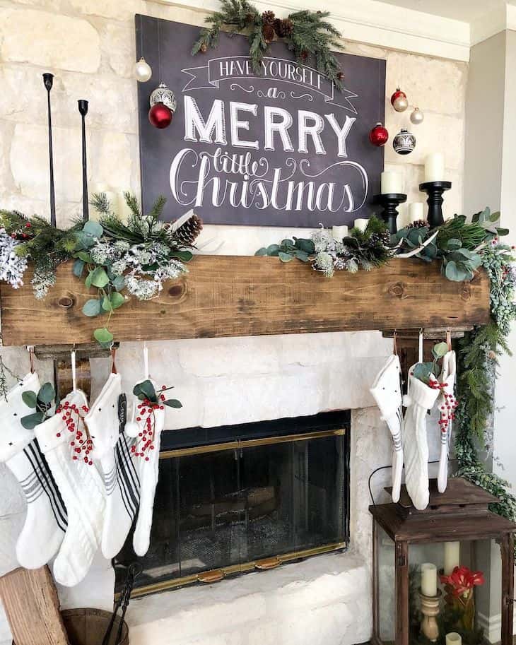 Big Christmas sign over a wood mantel