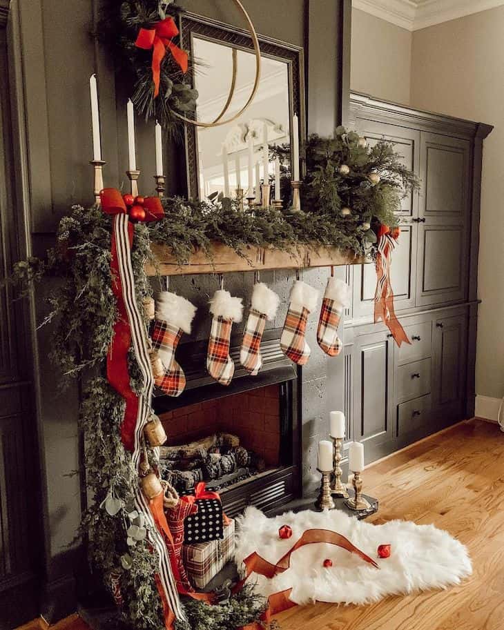 Christmas decor in red and green for black fireplace