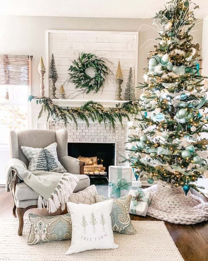 White shiplap mantel with green and blue Christmas decor