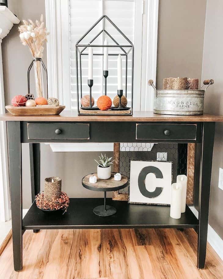 Black entryway table with fall decor