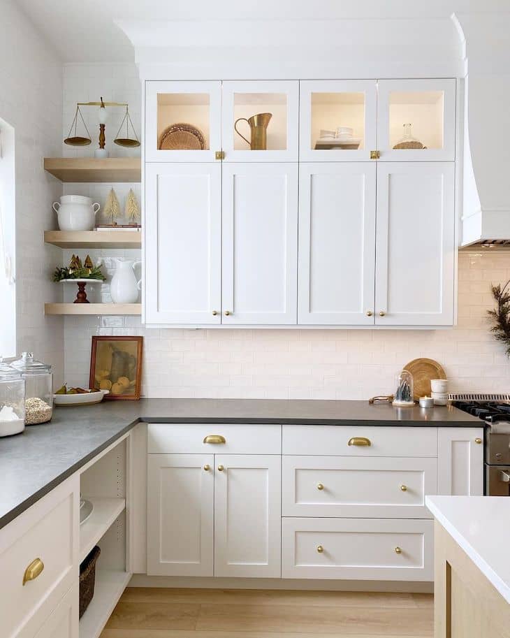 Black honed quartz countertop kitchen with white cabinets